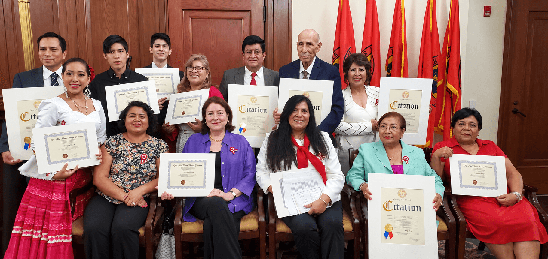 PACCLI honorees and community members holding citations and certificates